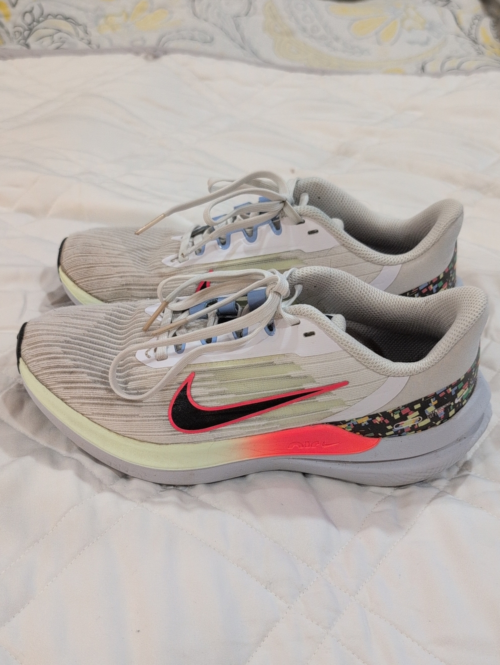 Nike Women's Light Gray Running Shoes with Pink & Black Accents